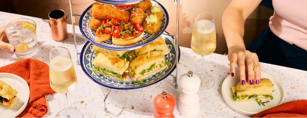 Someone eating pasta and a salad at Prezzo