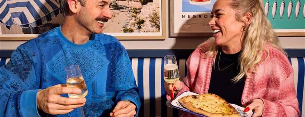Couple enjoying each other's company at diner